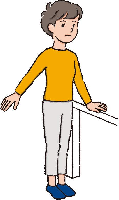 片手で支えながら立つ